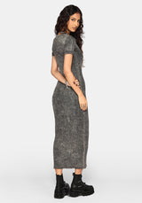A woman modeling a short-sleeve, acid-wash gray maxi dress with a textured, faded finish, paired with black platform ankle boots against a light gray studio background.